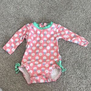 RuffleButts Golf Ball Girlie Print Long Sleeve One-Piece Swimsuit